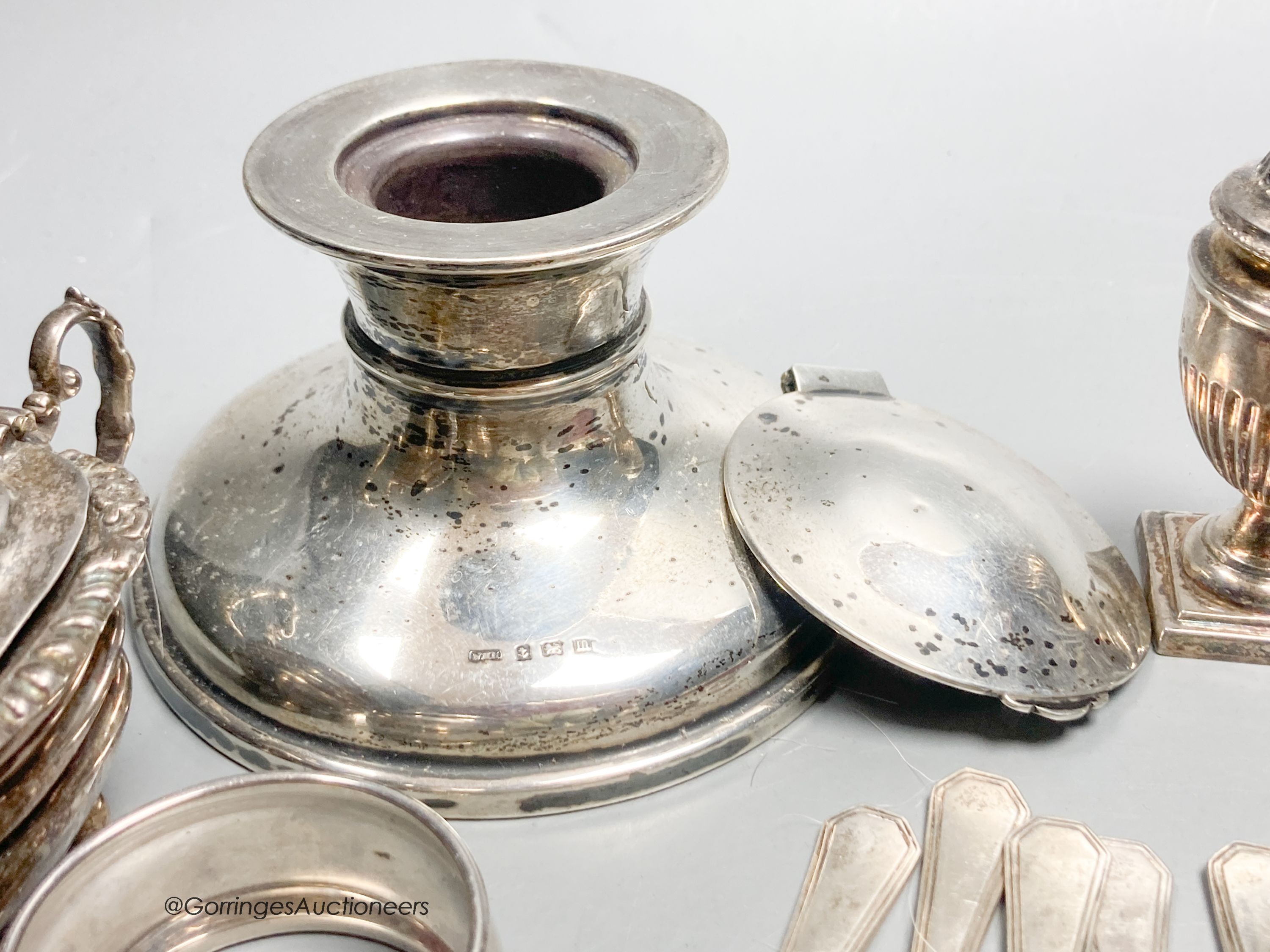 Sundry small silver including cased spoon, two mounted inkwells, two small trophy cups, condiments, cake forks etc.